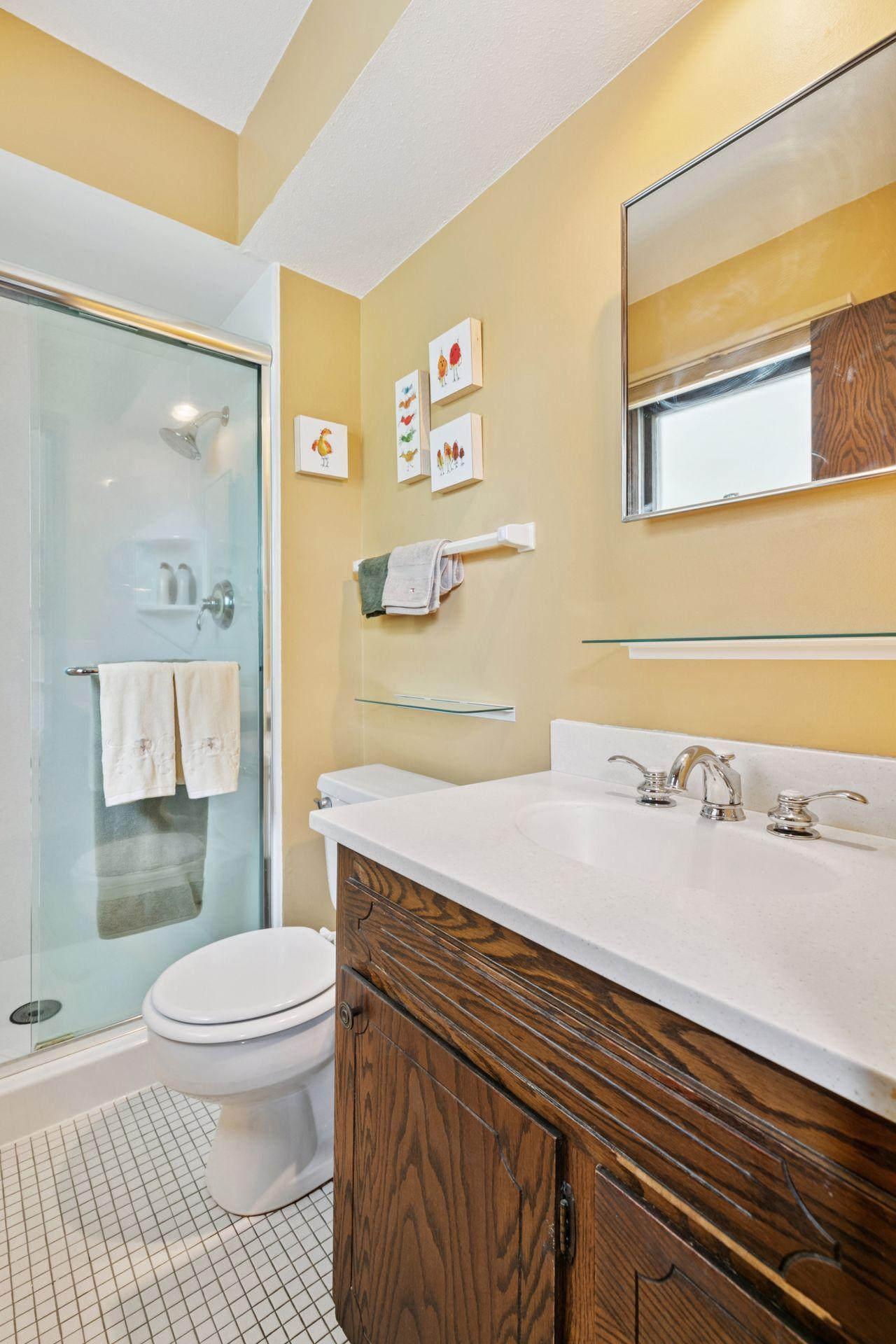 3/4 bath with glass shower enclosure.