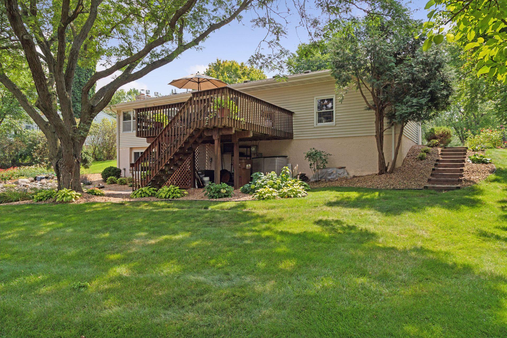 Flat backyard with overlooking deck.