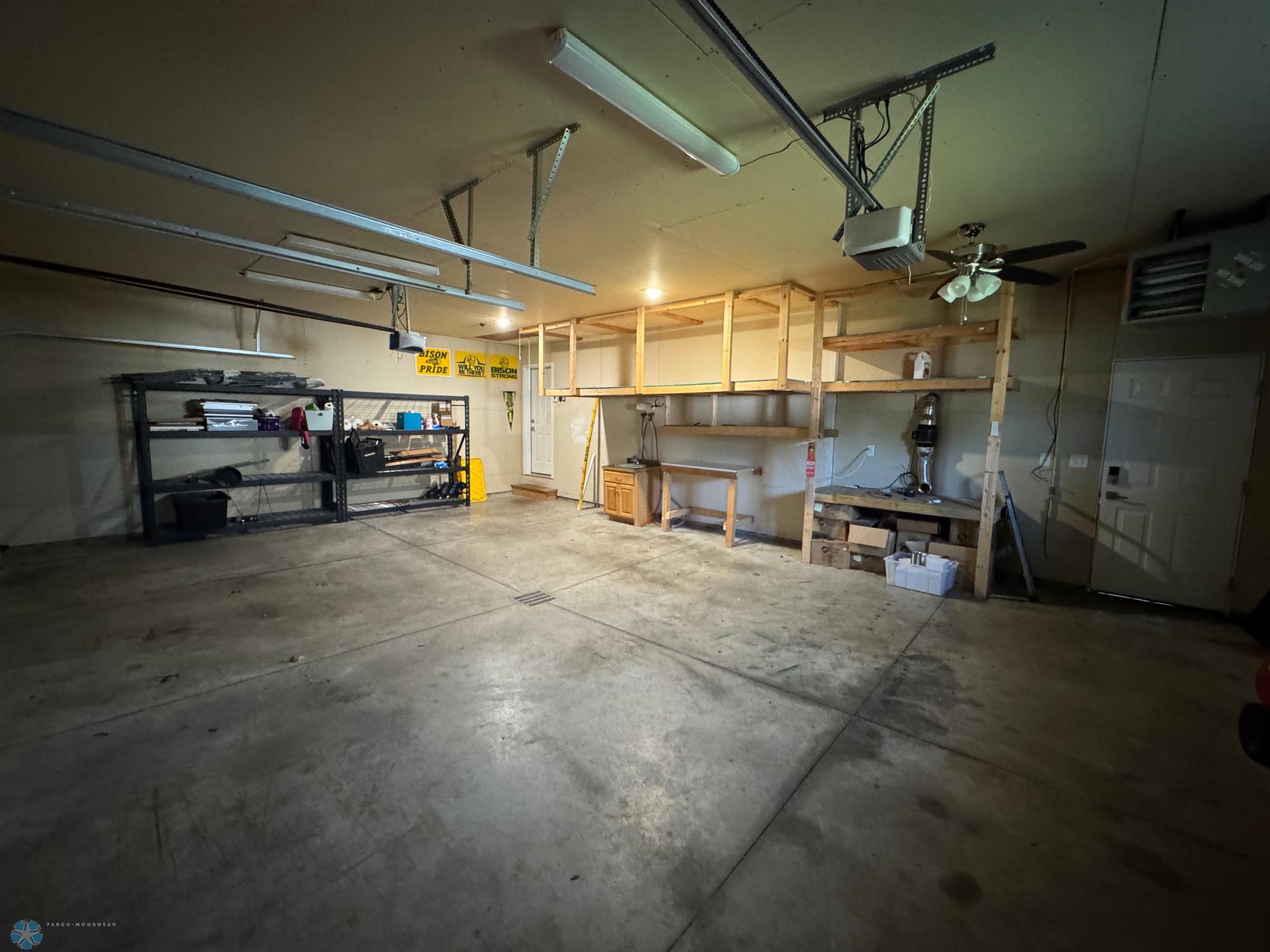 Garage with Floor drain and shelving.