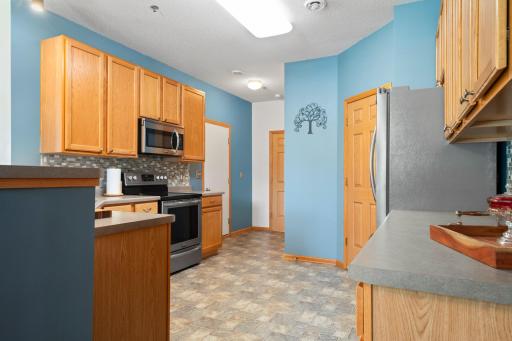 Kitchen w/a Huge Walk-In Pantry & is Located Adjacent to Attached 2 Car Garage & 1/2 Bath