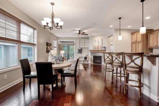 Open-concept living area with a gas fireplace, spacious layout, and direct access to the screened-in deck.