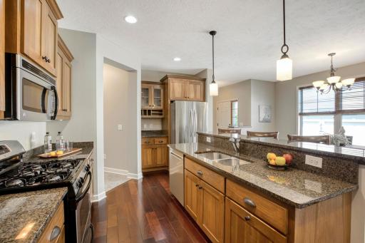 Well-designed kitchen with custom cabinetry, and a functional layout perfect for entertaining.