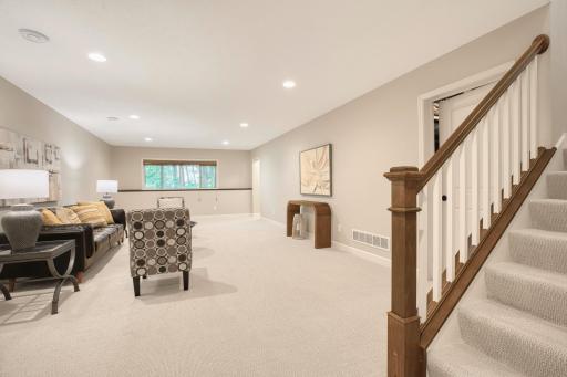 Bright and open lower level ideal for a second living area, entertainment, or game space.