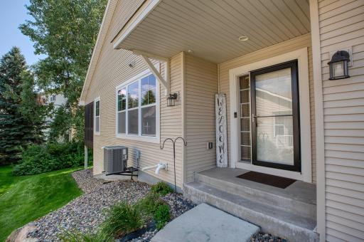 Welcoming covered entryway with storm door and space for seasonal dÃ©cor.