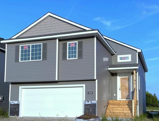 3216 Kady Ave NE- Home is under construction and will be ready for move-in on 10/16/2025! Stone accents & driveway will be installed soon. Front door will be painted. Home features a finished walkout lower level.