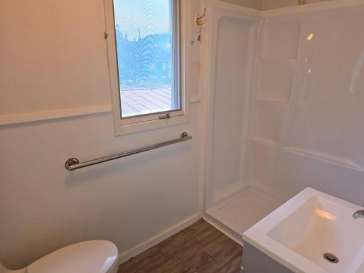 Updated and easy! The bath is right up-to-date and free of the nightmares of old tile and grout to maintain.