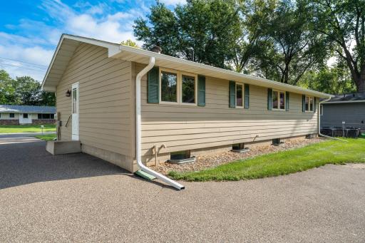 Parking and storage are well accommodated with an oversized, 2-car detached garage. It is complete with a remote opener and shelving, along with an additional 1-car parking pad. Perfect for guests or extra vehicles!