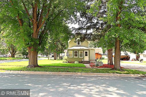 Welcome to 711 2nd St N in Dassel! Mature trees create a canopy as you walk up to your front door