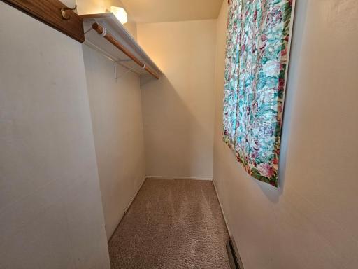Walk in closet, primary bedroom