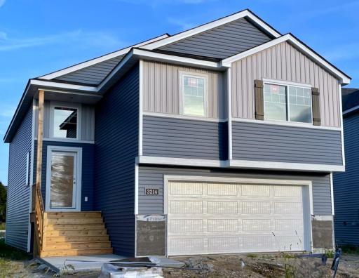 3214 Kady Ave NE- Home is under construction offering an estimated October move-in! Highlights include a finished walkout lower level located on a Cul-De-Sac homesite! Stone accents and driveway will be installed soon. Front door will be painted.
