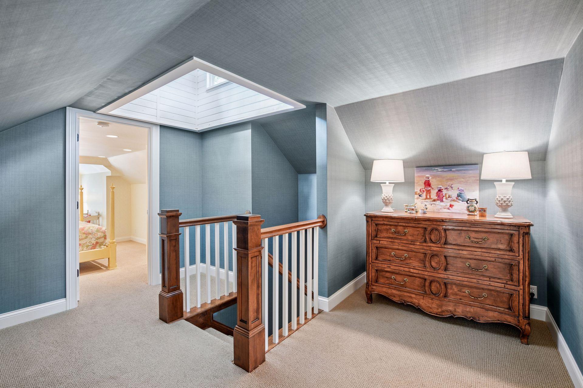 Head to the upper level to discover a lit up hallway from the sky light