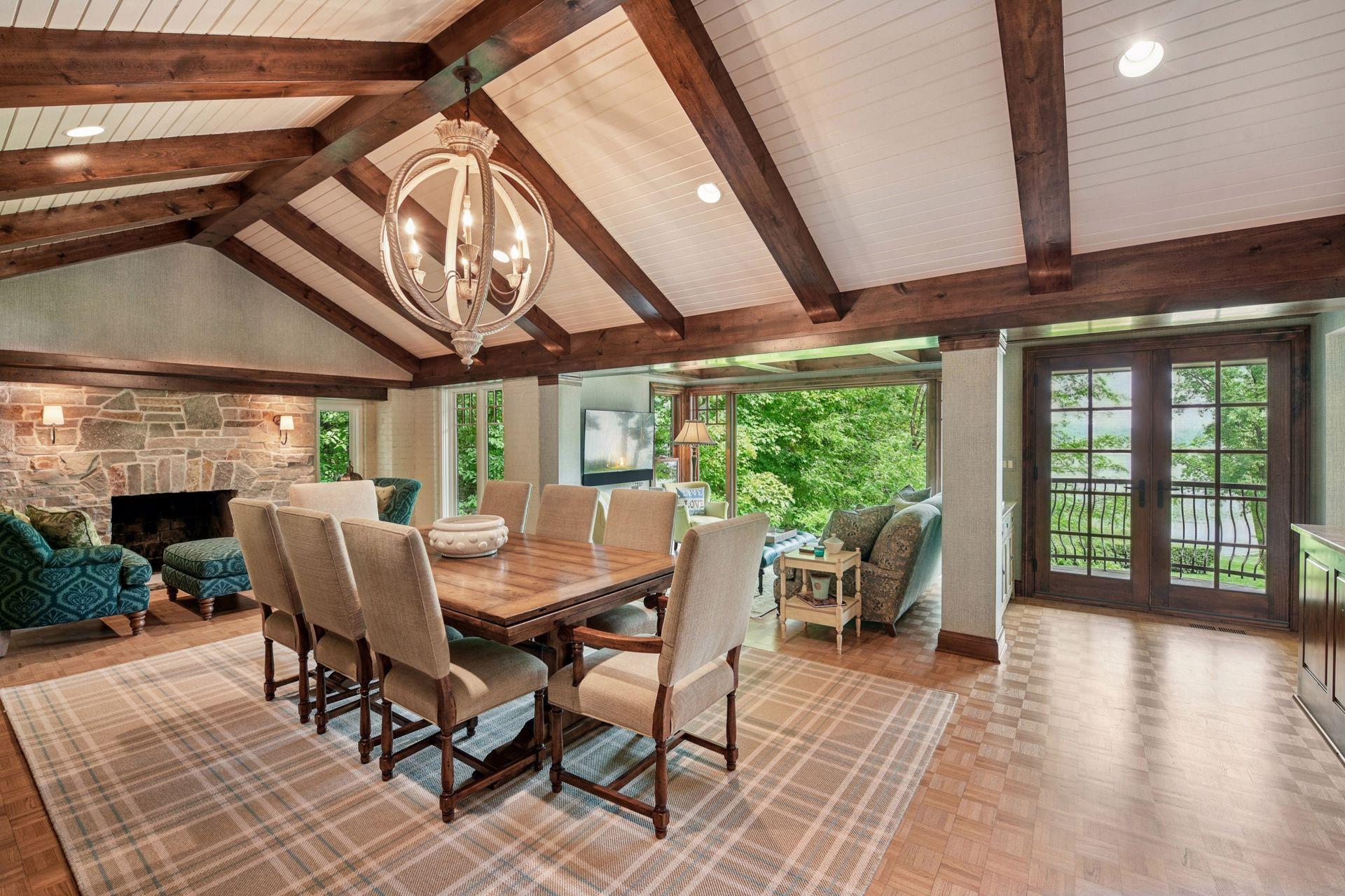 Lovely dining space with vaulted wood beam ceilings