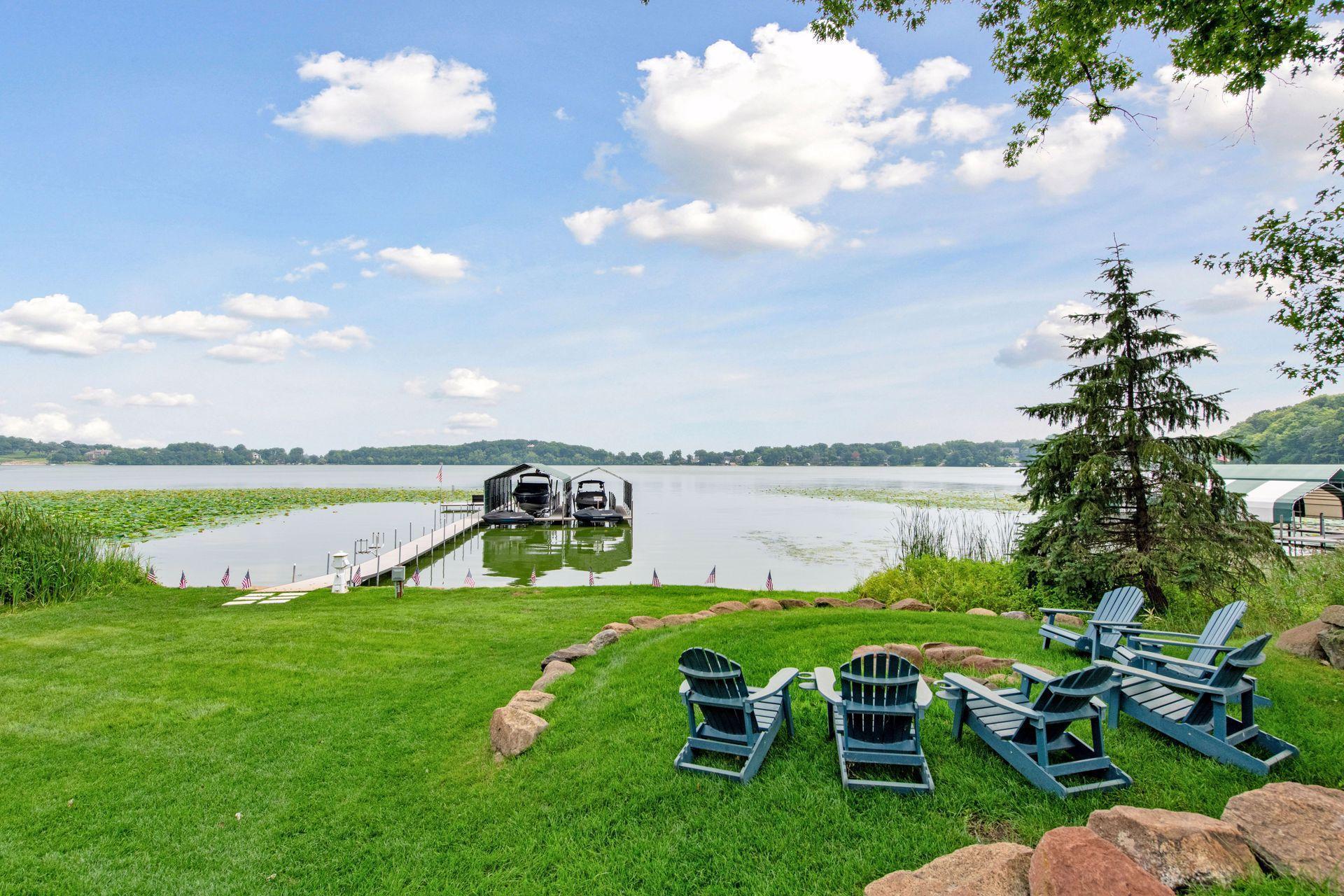 Beautiful firepit area and lake life views with 2 electronic boat and jet ski lifts