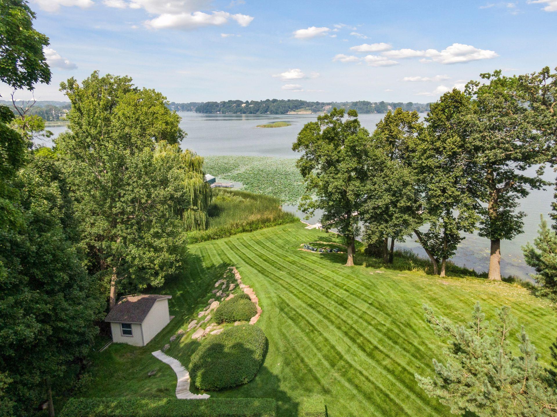 Tranquil backyard oasis offering privacy and open lawn space