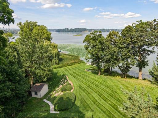 Tranquil backyard oasis offering privacy and open lawn space