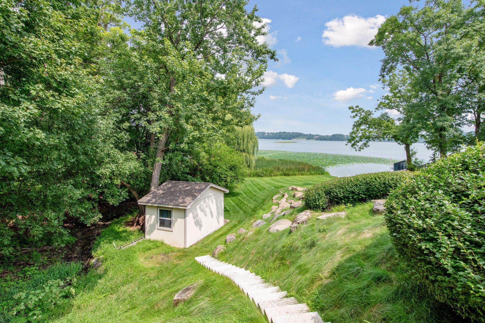 Storage shed tucked down the hill with space to store lake essentials