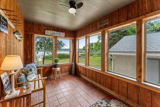 Beautiful views of lake fully enclosed with outdoor ceiling fan