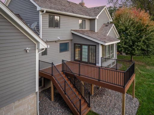 New maintenance-free deck, railing, and stairs that lead to the spacious backyard