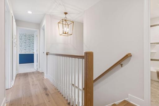 Head to the upper level to discover the four upper level bedrooms
