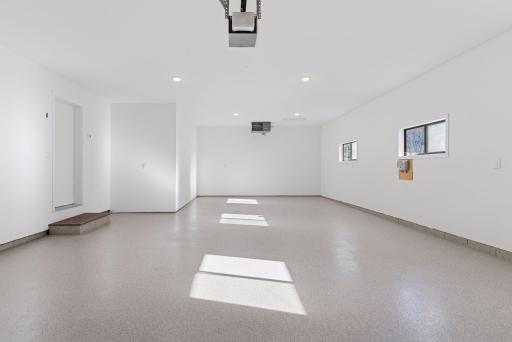 Step into this newly finished, insulated, and gas-heated garage, spacious enough to accommodate three cars comfortably, ensuring year-round convenience and protection.