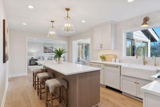 Featuring a 10â overhang on two sides, the kitchen island provides extra seating space, perfect for a quick bite or gathering.