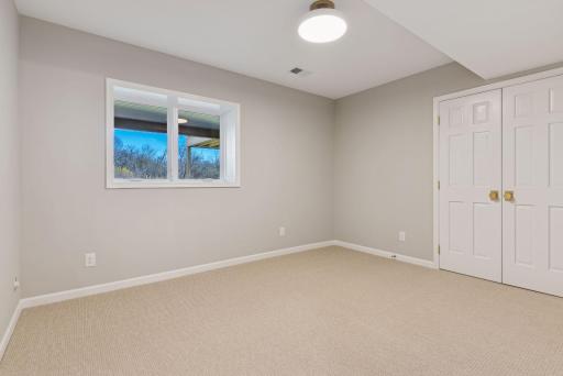 Step into the fifth bedroom which is located on the lower level which features a new egress window and closet space