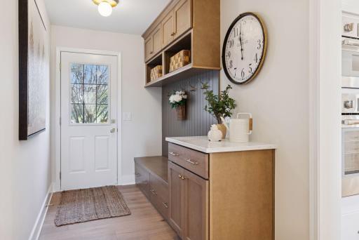 Beautiful new built-in bench with abundant storage and thoughtful organizational detailsâperfect for keeping this mudroom neat and stylish.