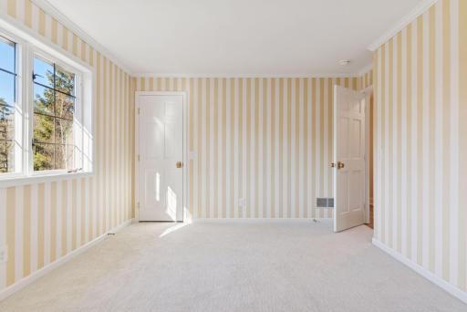 Second bedroom on the upper level with closet space
