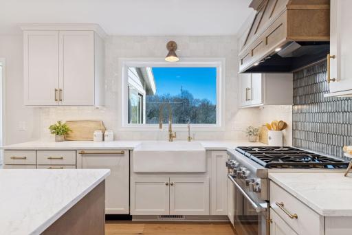 Marvel at the expansive, new oversized window offering picturesque east-facing views from the kitchen