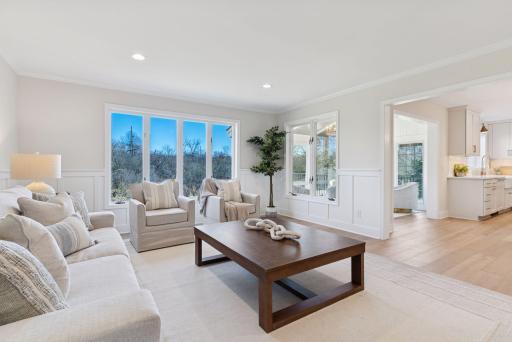 Enjoy this spacious living area designed for entertaining, beautifully lit up by an abundance of natural light.