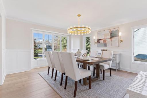 The main floor showcases exquisite details, including updated wainscot, trim, and elegant cove molding, adding a touch of sophistication to every room.