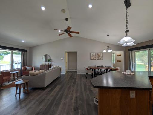 Gorgeous flooring and vaulted ceiling are highlights of open concept main floor.