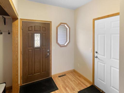 The primary suite offers a walk-in closet, and the lower level includes a finished space with an egress window for a potential third bedroom.