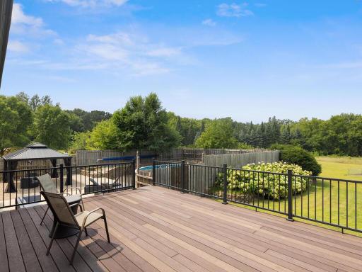 Expansive maintenance-free deck, perfect for morning coffee. West facing for amazing sunset views