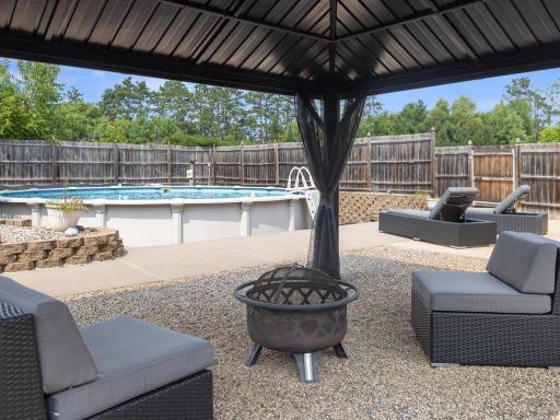 Spend summer days in the solar-heated saltwater pool, entertain on the expansive patio, or relax on the maintenance-free deck overlooking your peaceful acreage