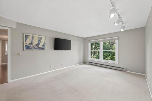 2025, 3020 SAM #215, View of Primary Bedroom with natural view out windows.jpg