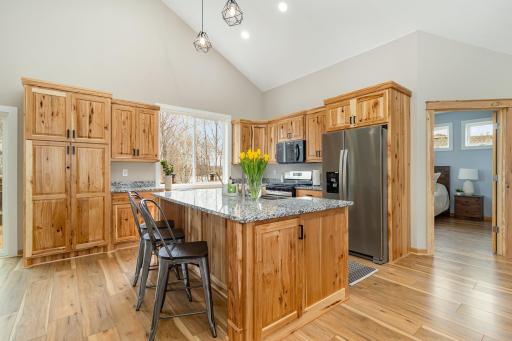 Beautiful Hickory Cabinets and Quartz countertops.