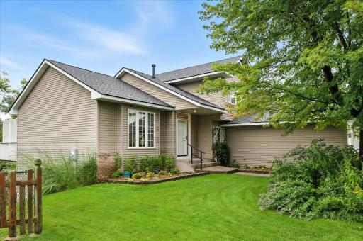 2307 Belfast St W Front view with Pollinators and great lawn