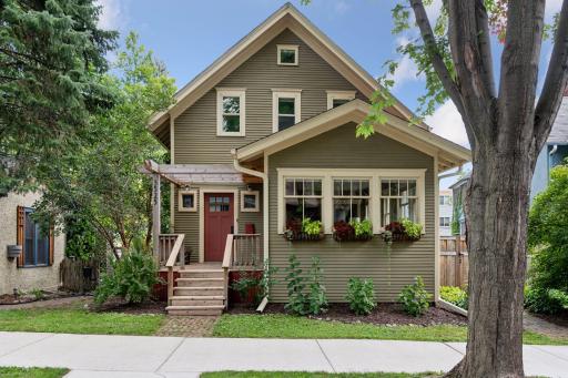 Welcoming front porch and window boxes add to the home’s undeniable curb appeal.