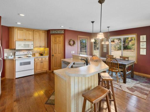 Kitchen features beautiful Birch cabinetry and walnut wood floors.