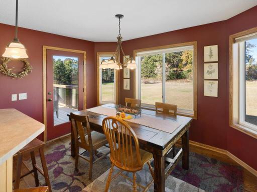 Informal Dining Room features walnut wood floors and walks out to Deck and expansive backyard