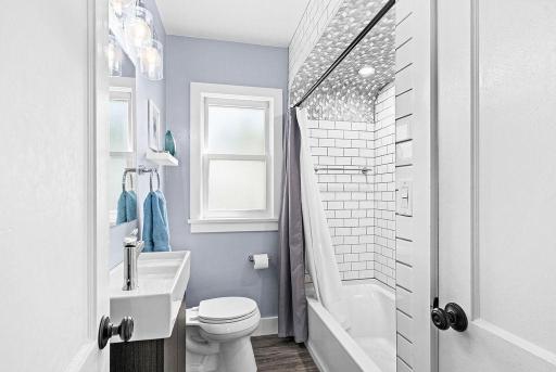 Main floor full bath with beautifully tiled shower!