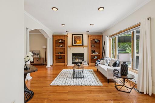 Family room with wood burning fireplace and custom built ins!