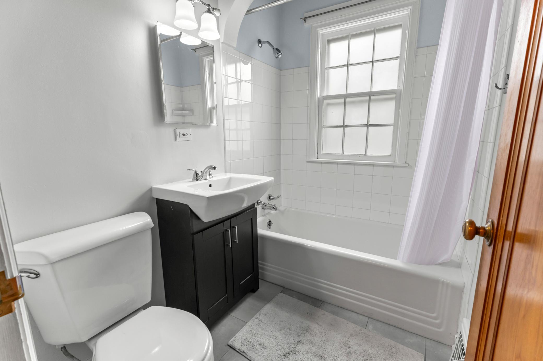 Main level bathroom with new floor.