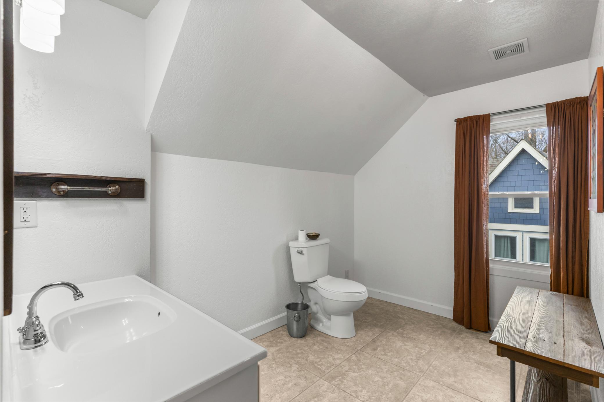 Space for additional storage in this large bathroom.