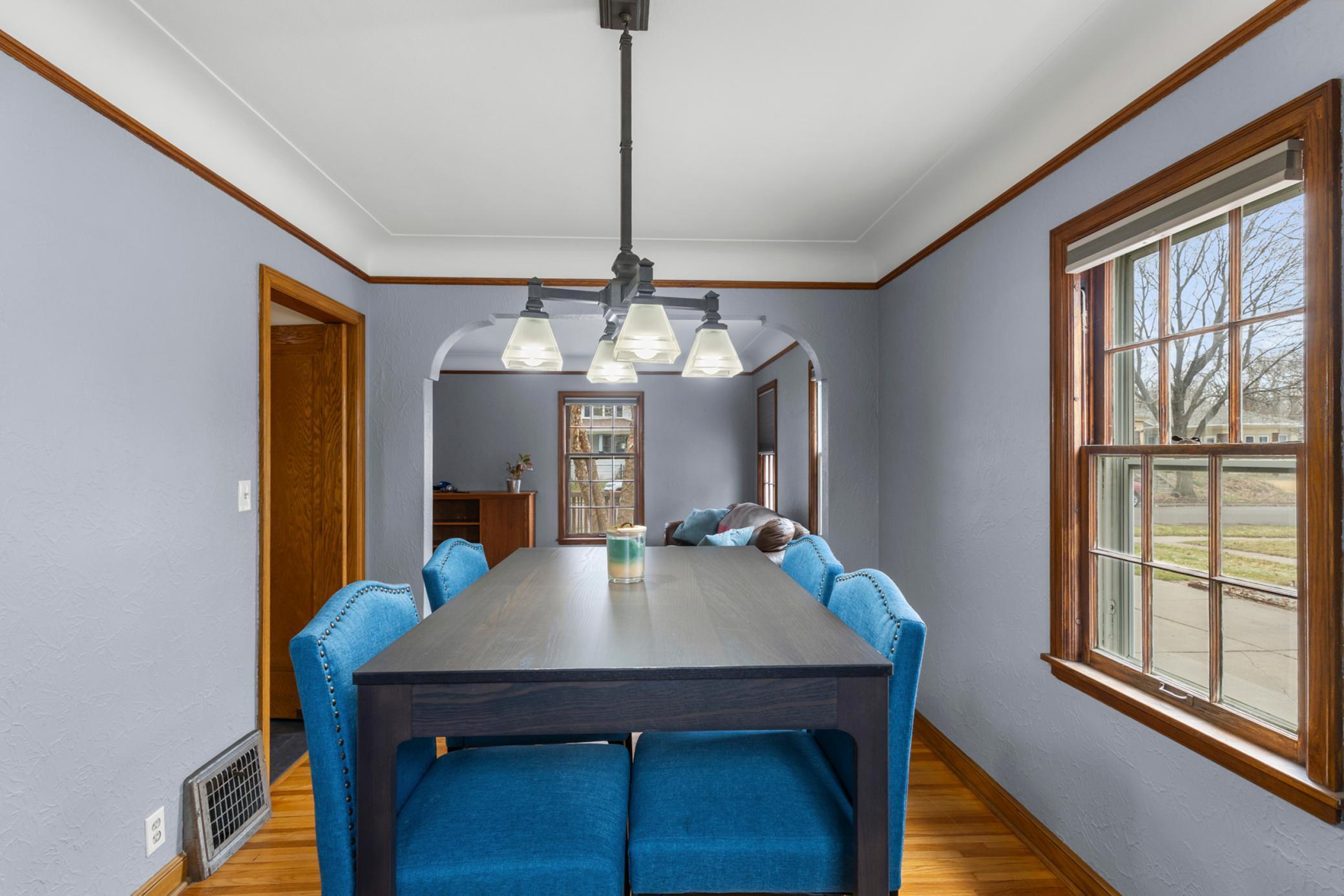 Dining room looking through stunning archway to living room.