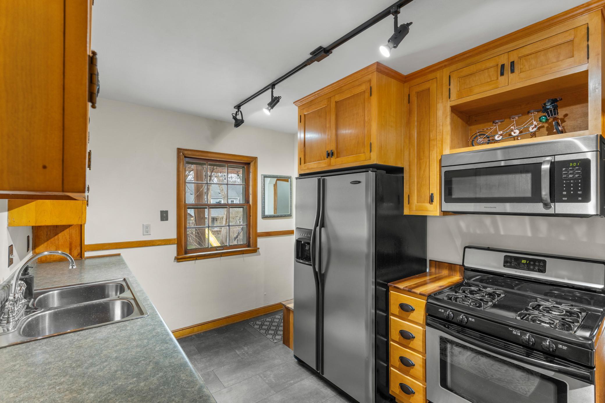 Kitchen with gorgeous wood cabinetry.