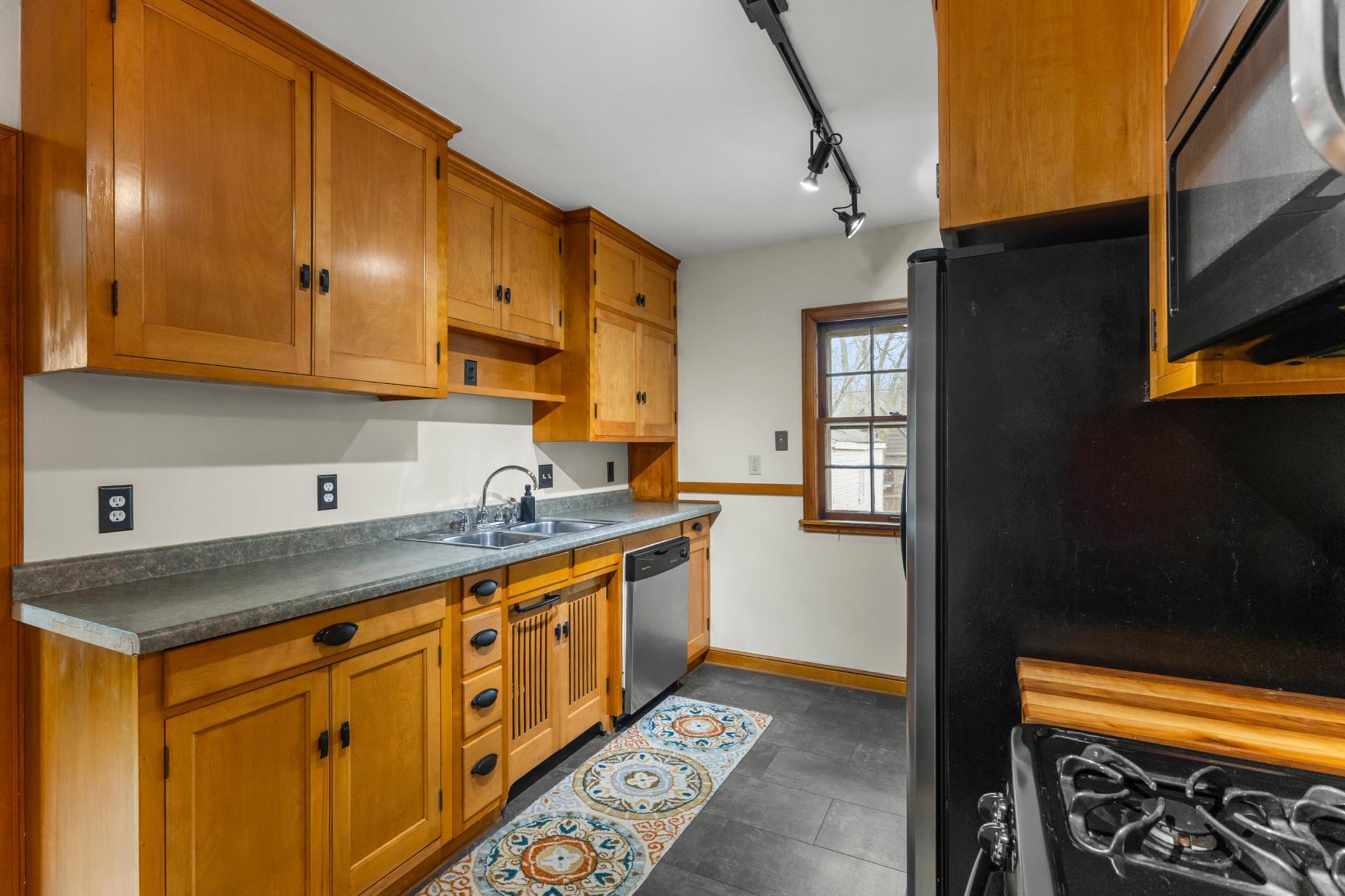 Kitchen window overlooking backyard.