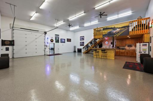 Rec area with beautiful epoxy flooring, large overhead door for entertaining or showcase