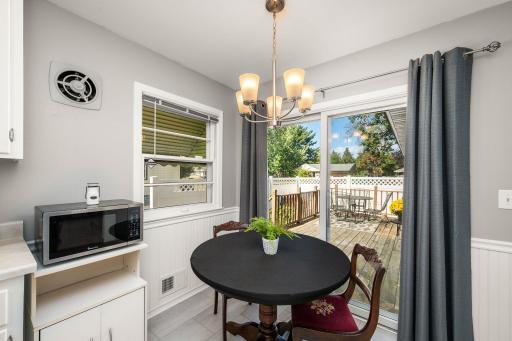 From your eat-in kitchen, Step out the newer sliding glass door to your deck and private side yard!